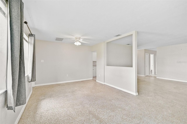 unfurnished room with a barn door and ceiling fan