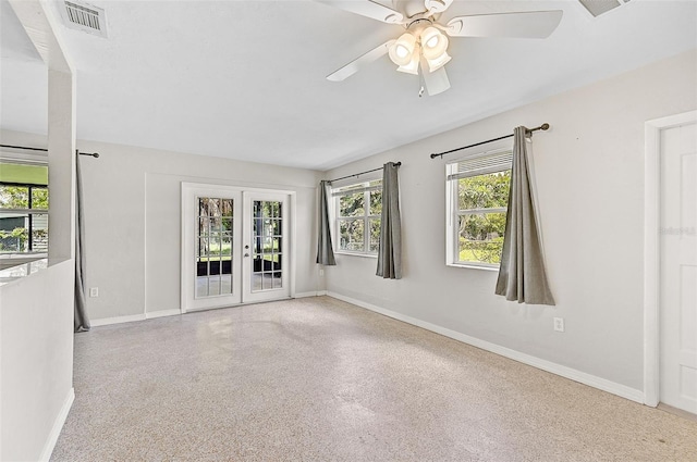 empty room with french doors and ceiling fan