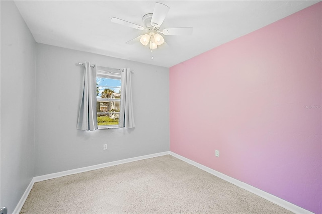 empty room with ceiling fan and carpet flooring