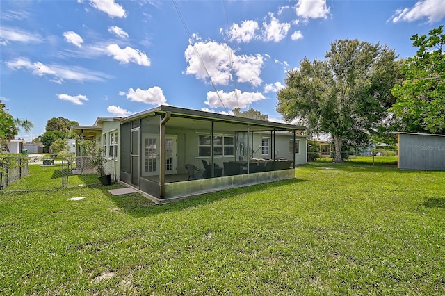 back of house featuring a yard