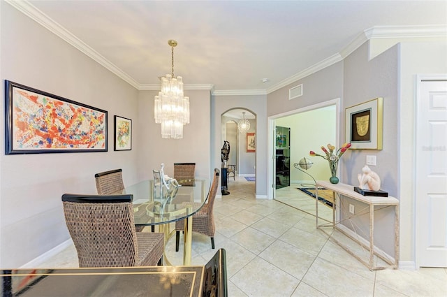 tiled dining space featuring ornamental molding and a chandelier