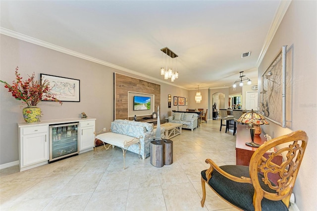 tiled living room featuring ornamental molding and beverage cooler