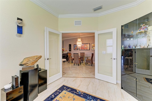 hallway featuring crown molding and french doors