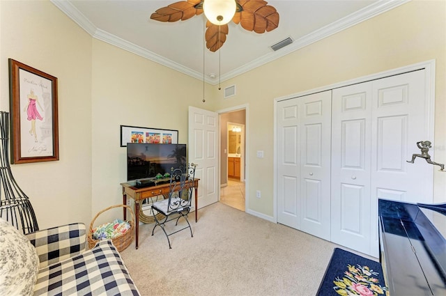 carpeted office with ornamental molding and ceiling fan