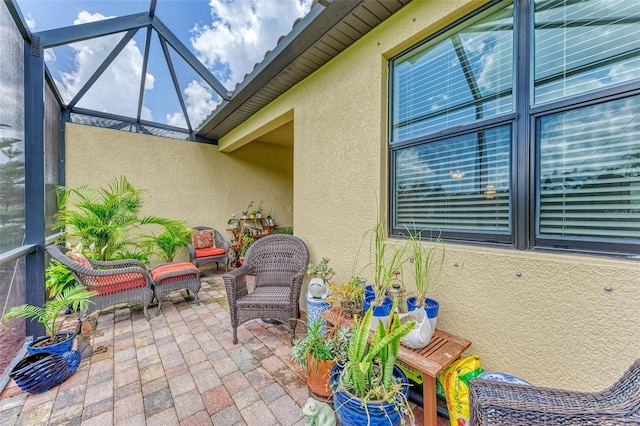 view of patio / terrace with outdoor lounge area and a lanai