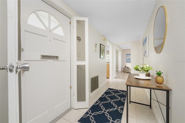 foyer with light tile patterned flooring