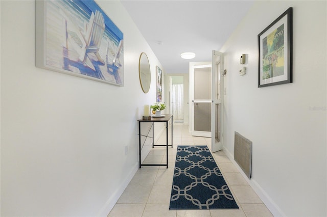 corridor featuring light tile patterned flooring