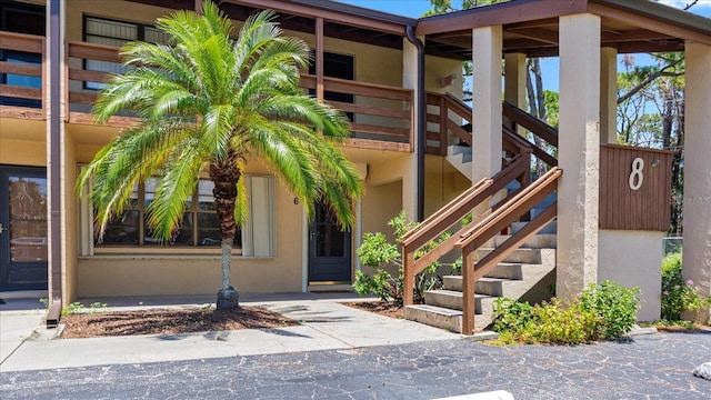 doorway to property with stucco siding