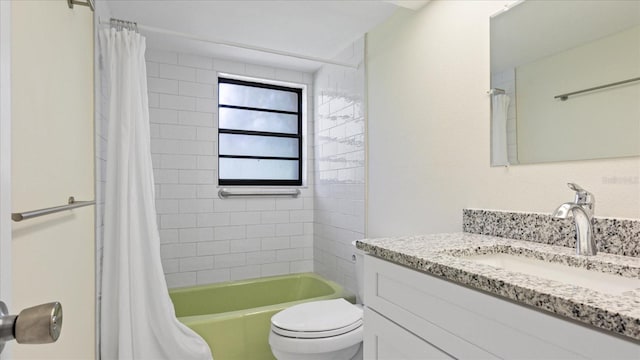 full bathroom featuring shower / bathtub combination with curtain, toilet, and vanity