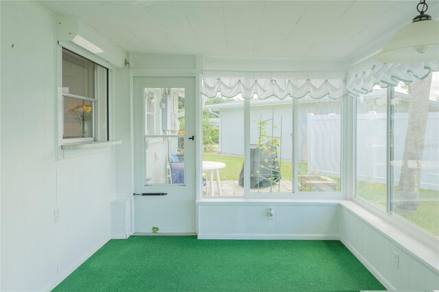 unfurnished sunroom with plenty of natural light