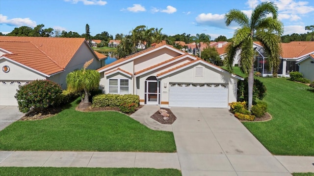 view of front of house with a garage and a front yard