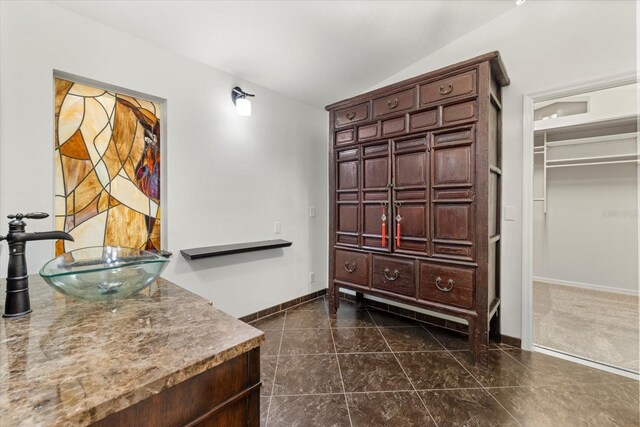 bathroom featuring tile patterned flooring and vanity