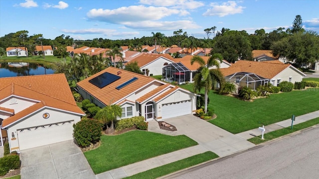 birds eye view of property with a water view