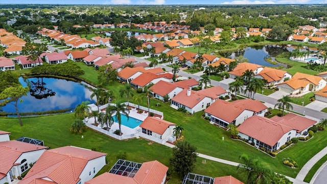 birds eye view of property featuring a water view