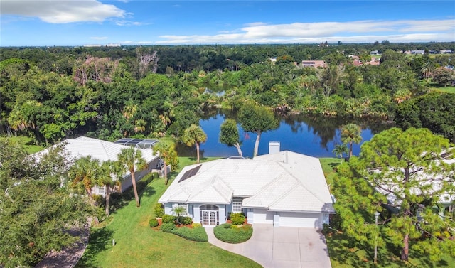 birds eye view of property with a water view