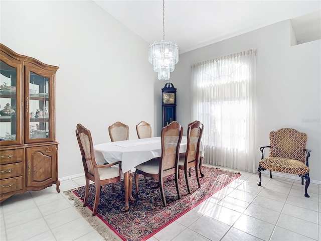 dining area featuring a healthy amount of sunlight, light tile patterned floors, and a chandelier