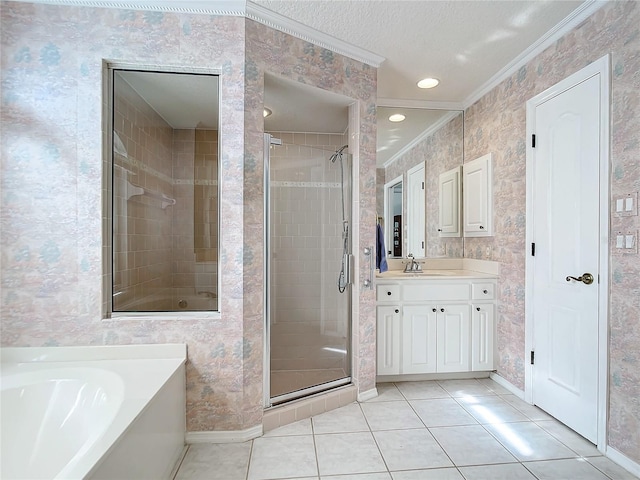 bathroom featuring shower with separate bathtub, ornamental molding, vanity, tile patterned floors, and a textured ceiling