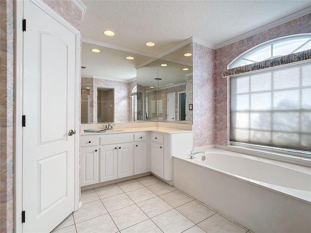 bathroom featuring crown molding, tile patterned floors, a textured ceiling, and vanity