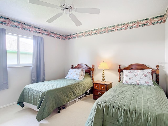 bedroom with ceiling fan and carpet floors