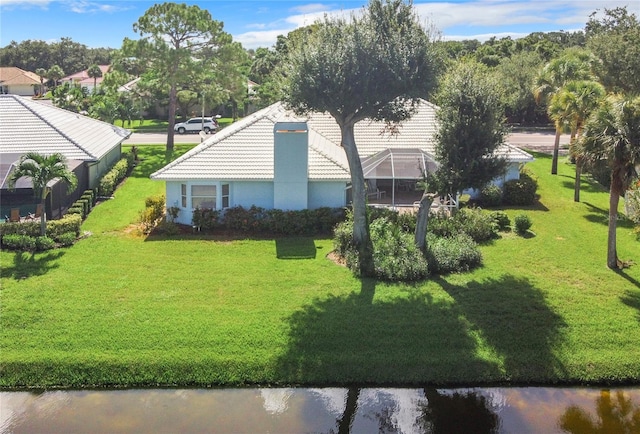 birds eye view of property with a water view