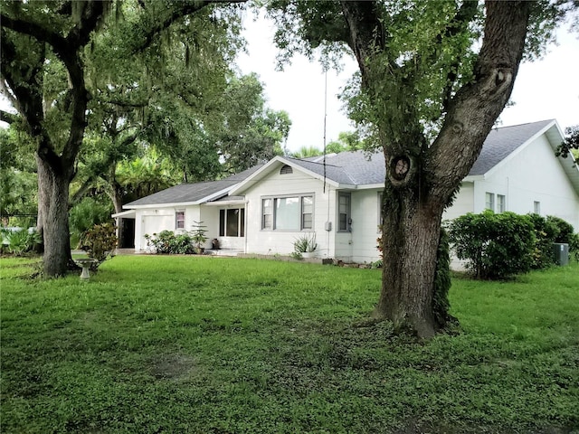 back of property featuring a yard