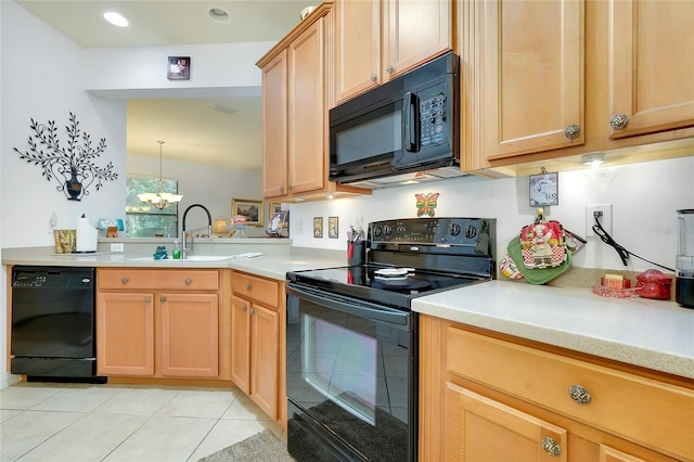 kitchen with a sink, black appliances, light tile patterned floors, and light countertops