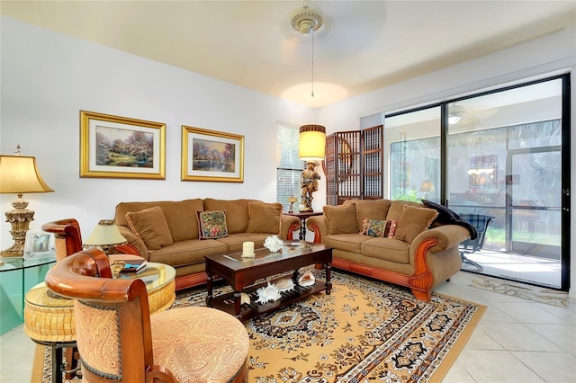 living area featuring light tile patterned floors and a wealth of natural light