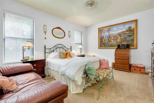 bedroom featuring light colored carpet