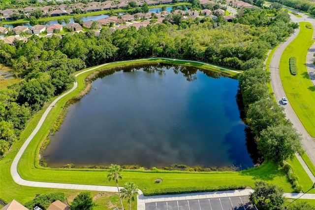 drone / aerial view with a water view and a residential view