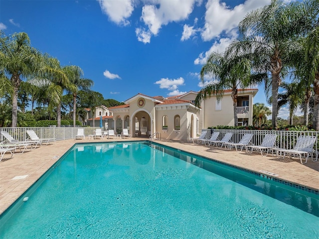 view of swimming pool with a patio area