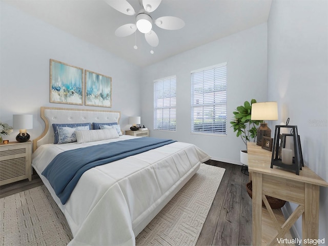 bedroom with hardwood / wood-style floors and ceiling fan