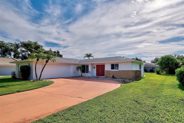 single story home with a garage and a front lawn