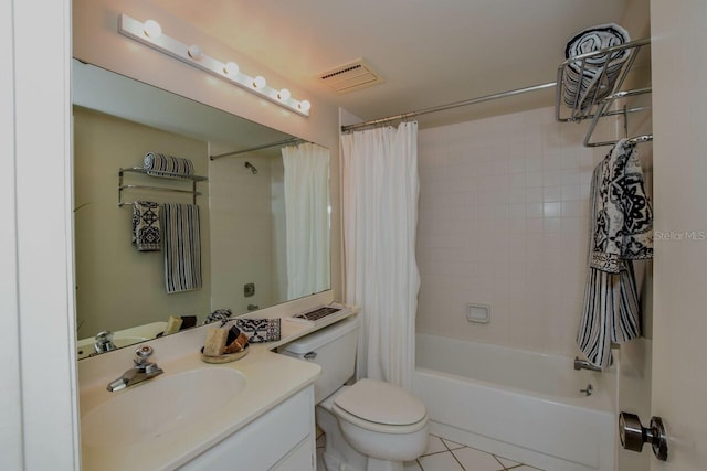 full bathroom featuring visible vents, toilet, shower / bath combo with shower curtain, vanity, and tile patterned flooring