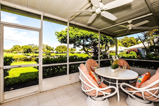 sunroom / solarium featuring ceiling fan