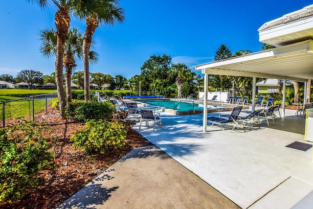 view of swimming pool with a patio area