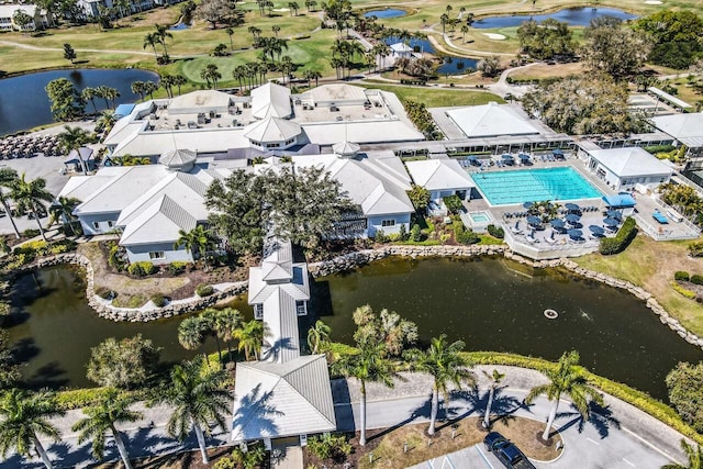 birds eye view of property featuring a residential view, a water view, and golf course view