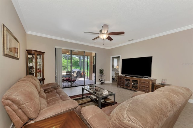 living room with ceiling fan, light tile patterned flooring, a textured ceiling, and crown molding