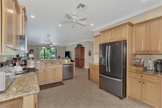 kitchen with ceiling fan, light brown cabinetry, light stone countertops, light tile patterned floors, and stainless steel appliances