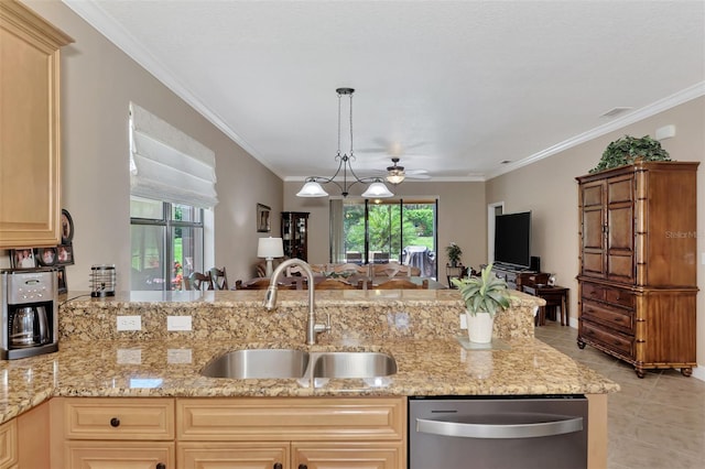 kitchen with decorative light fixtures, crown molding, open floor plan, a sink, and dishwasher