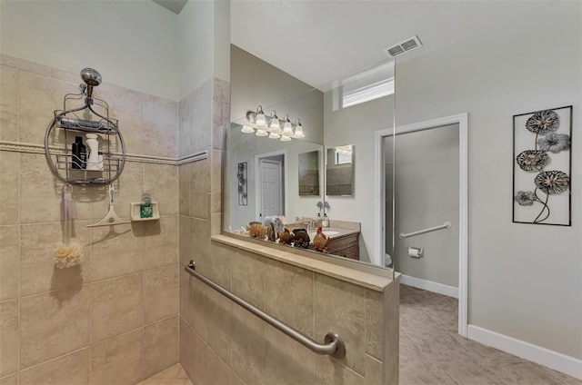 bathroom with vanity and tile patterned flooring