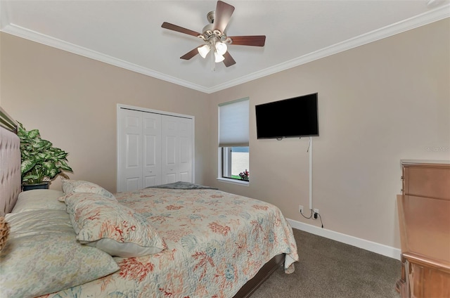 carpeted bedroom with ornamental molding, a closet, and ceiling fan