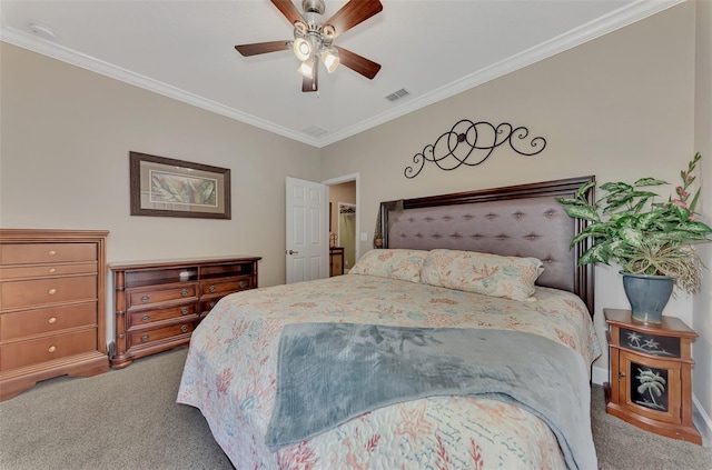 bedroom with ornamental molding, carpet flooring, and visible vents