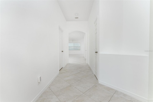 hallway featuring light tile patterned floors