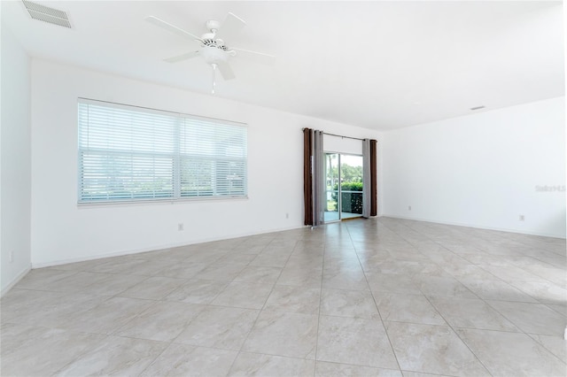 unfurnished room featuring ceiling fan