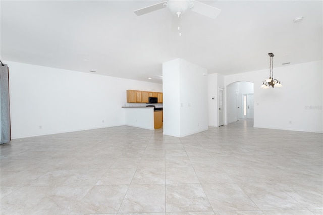 unfurnished living room featuring ceiling fan