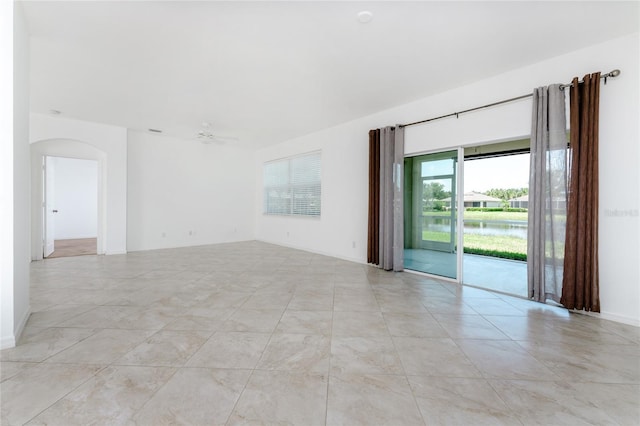 unfurnished room featuring ceiling fan