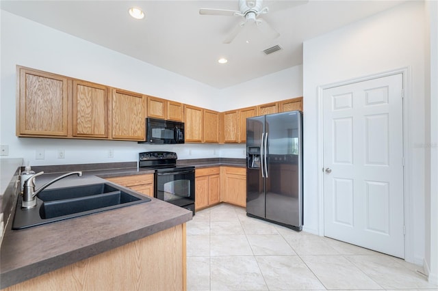 kitchen featuring light tile patterned flooring, ceiling fan, sink, and black appliances