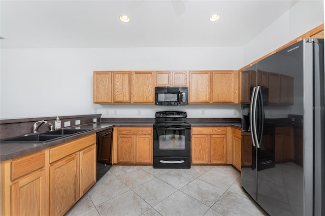 kitchen with sink, black appliances, and light tile patterned floors