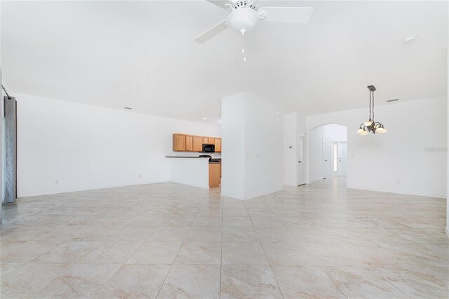 unfurnished living room featuring ceiling fan