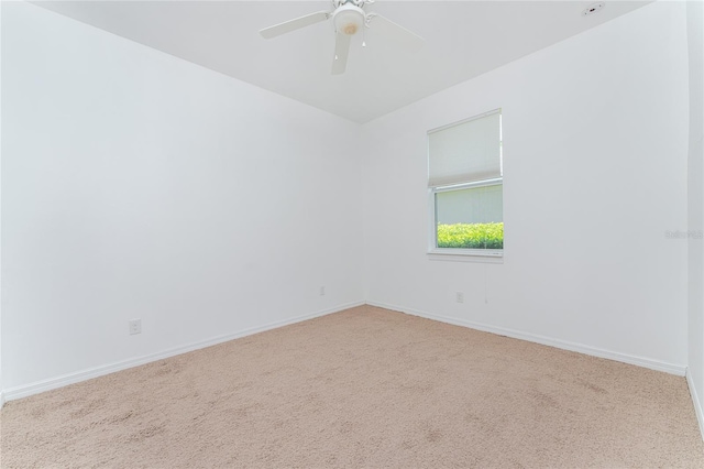 empty room with ceiling fan and carpet floors